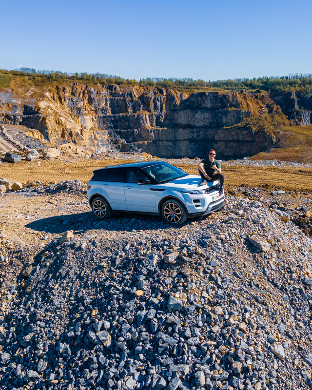 Off-road vehicle tackling terrain, aerial drone view