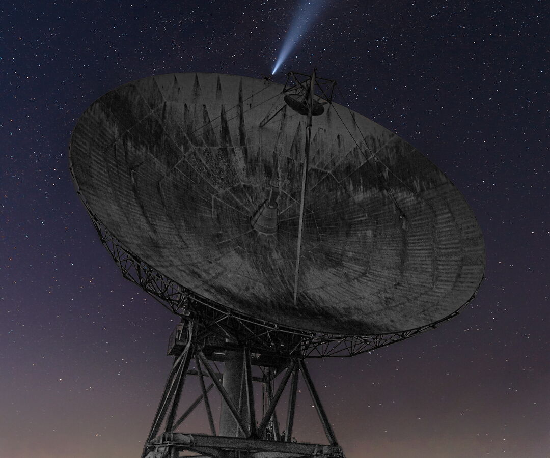 Parabolic antenna of the Lessive space telecommunications earth station, pointed at a starry night sky